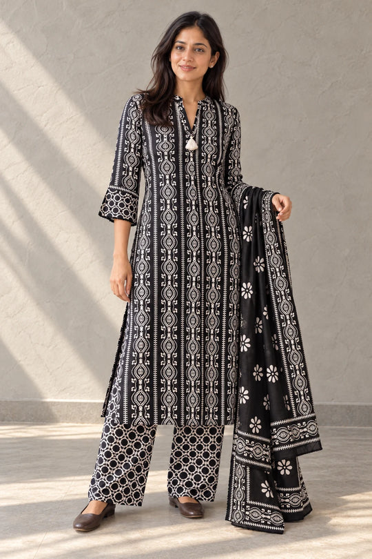 Woman in black and white Deewani batik kurta set with palazzo and dupatta, front view