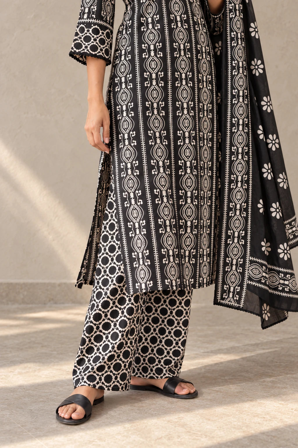 Black lattice-print palazzo and flower-print dupatta, with black sandals