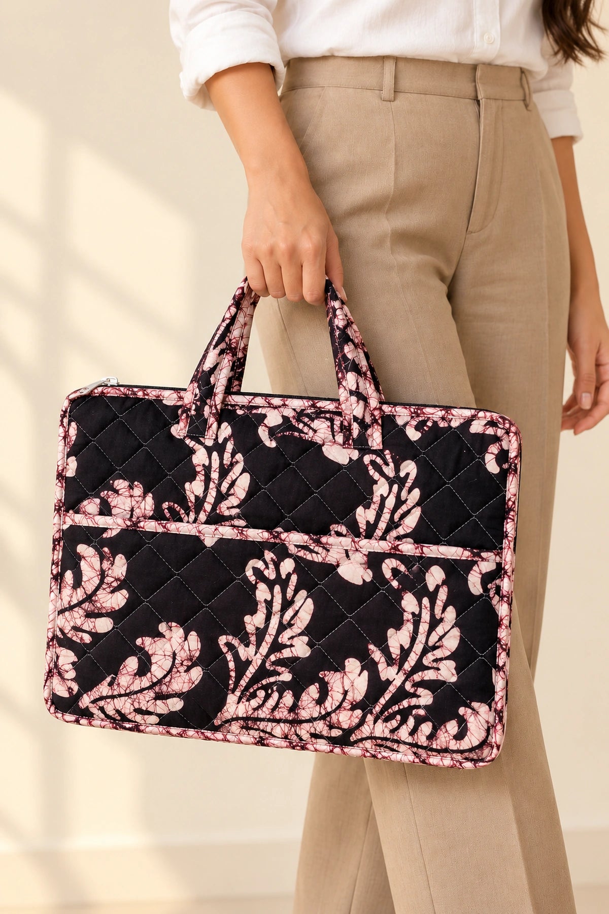 Quilted Batik Laptop Bag in Black Blush Leaf print – held in hand | Shades of You