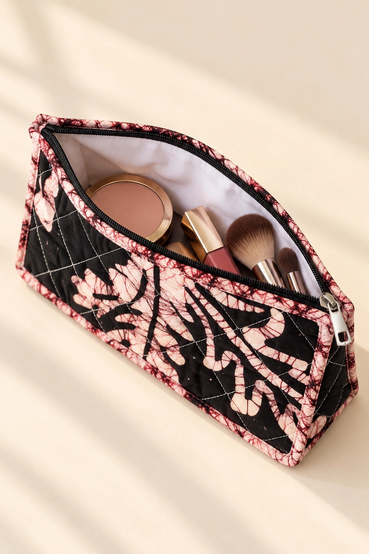 Quilted Batik Makeup Pouch in Black Blush Leaf print – open, showing the lined interior | Shades of You