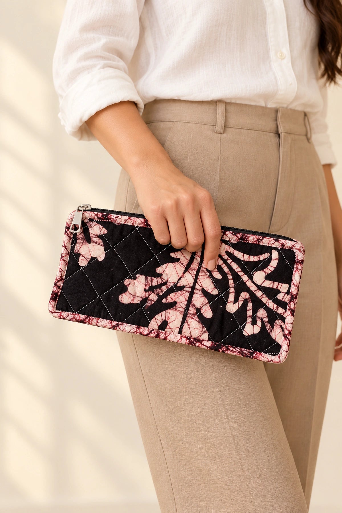 Quilted Batik Makeup Pouch in Black Blush Leaf print – held in hand | Shades of You