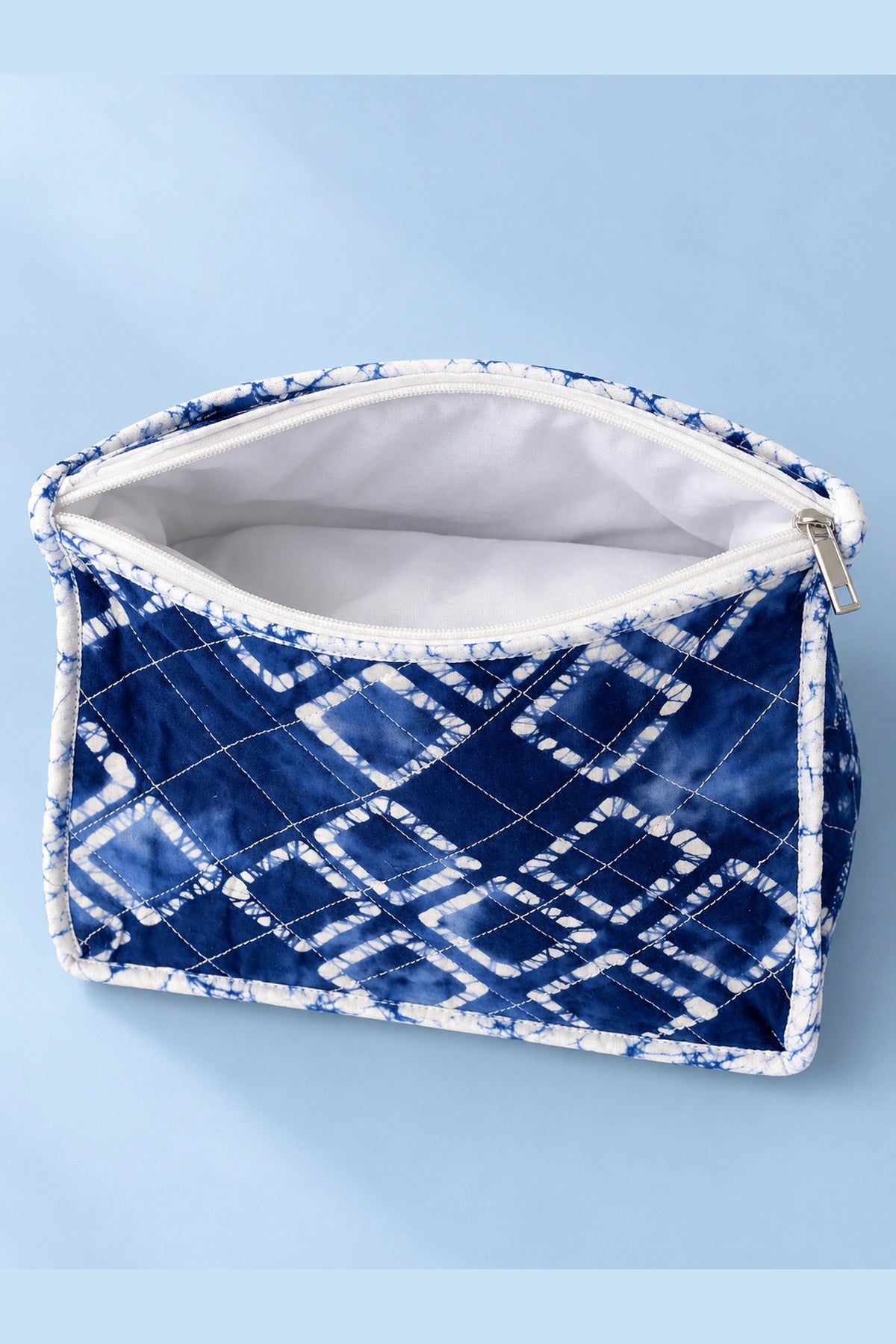 Quilted Batik Makeup Pouch in Blue Shibori Check print – open, showing the lined interior | Shades of You