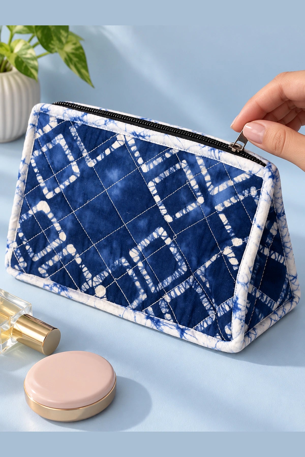 Quilted Batik Utility Pouch in Blue Shibori Check print – styled on a vanity | Shades of You