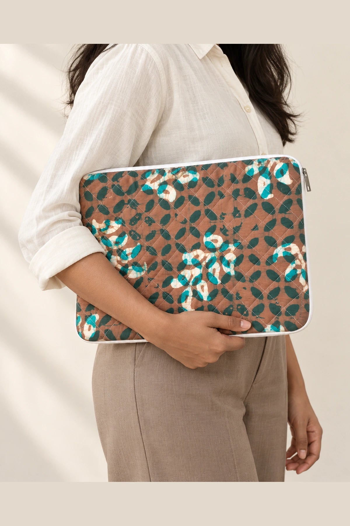 Quilted Batik Laptop Sleeve in Brown Teal Leaf print – held in hand | Shades of You