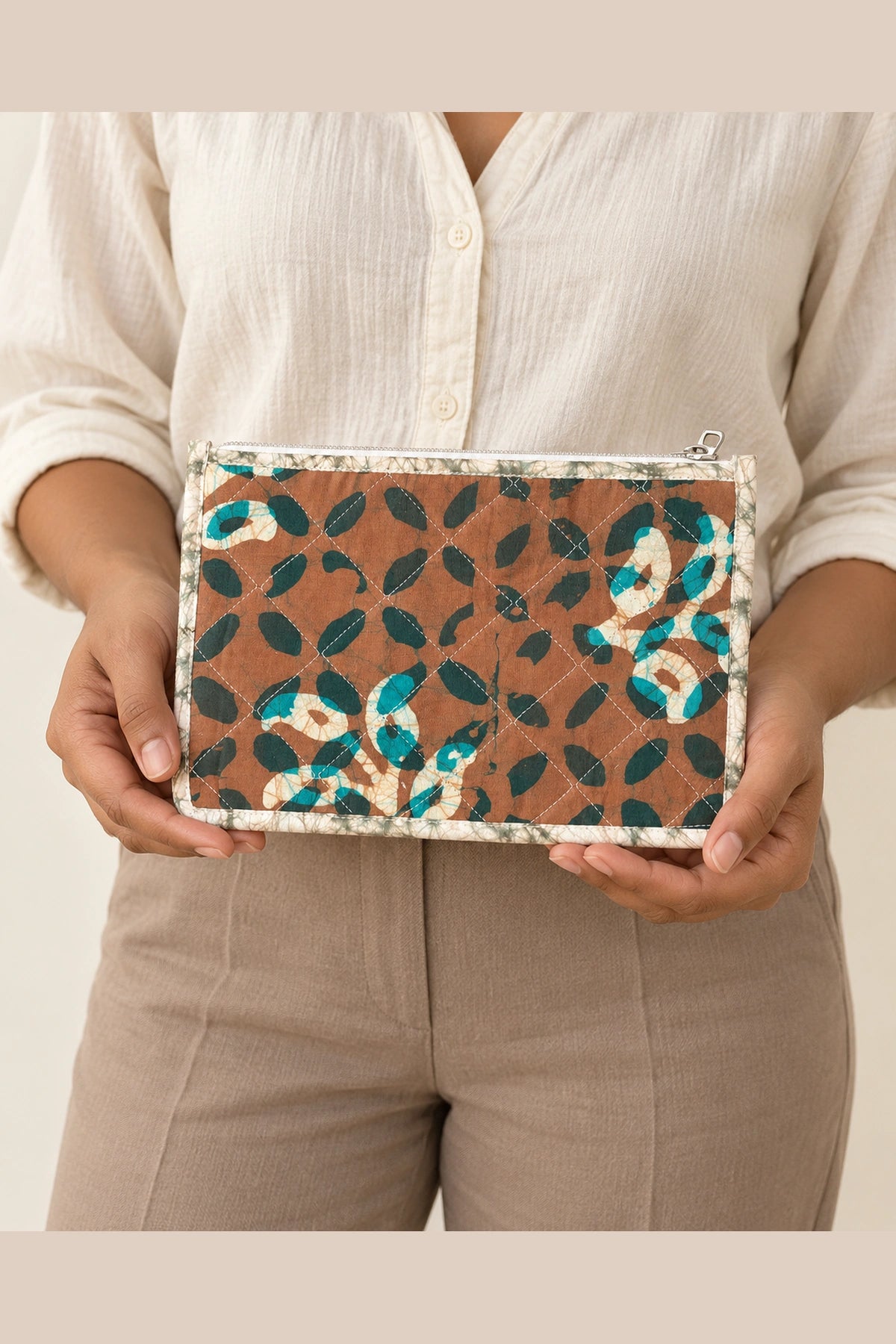 Quilted Batik Small Pouch in Brown Teal Leaf print – held in hand | Shades of You