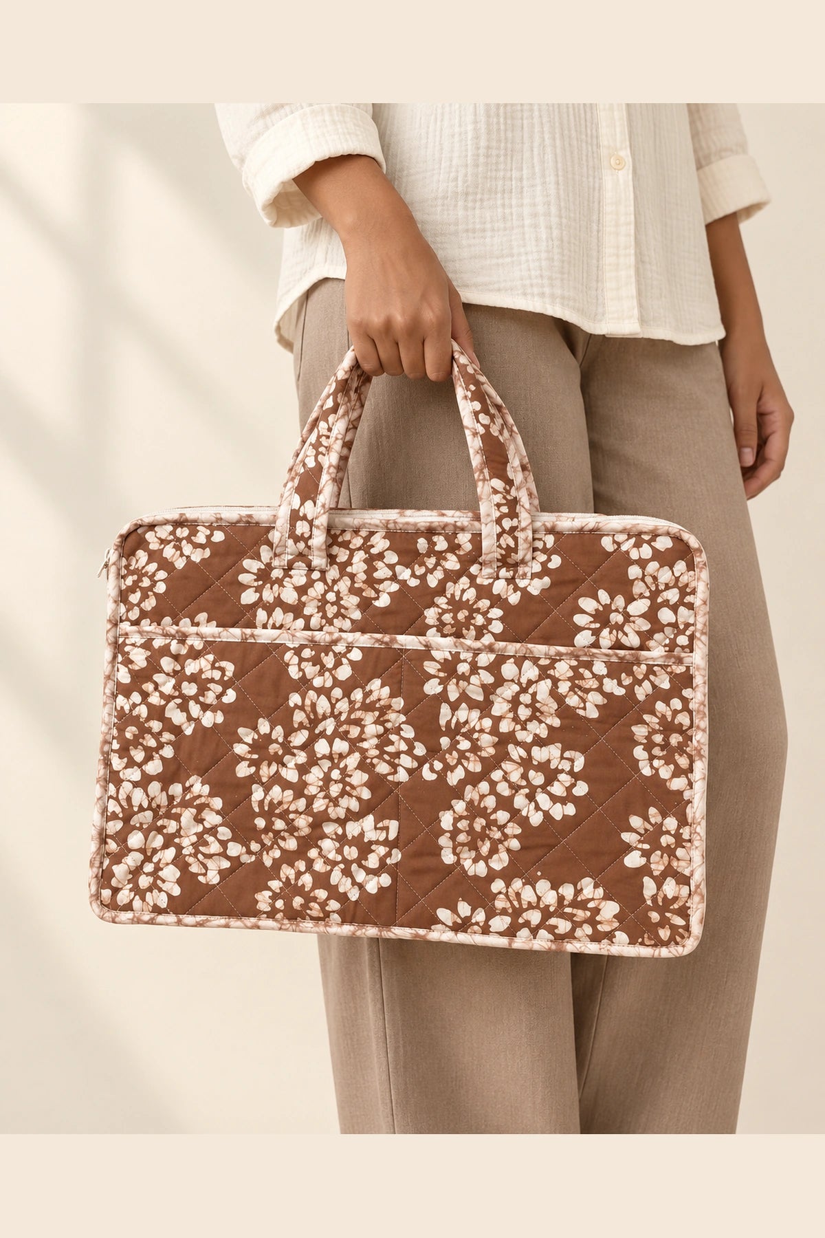 Quilted Batik Laptop Bag in Brown White Floral print – held in hand | Shades of You