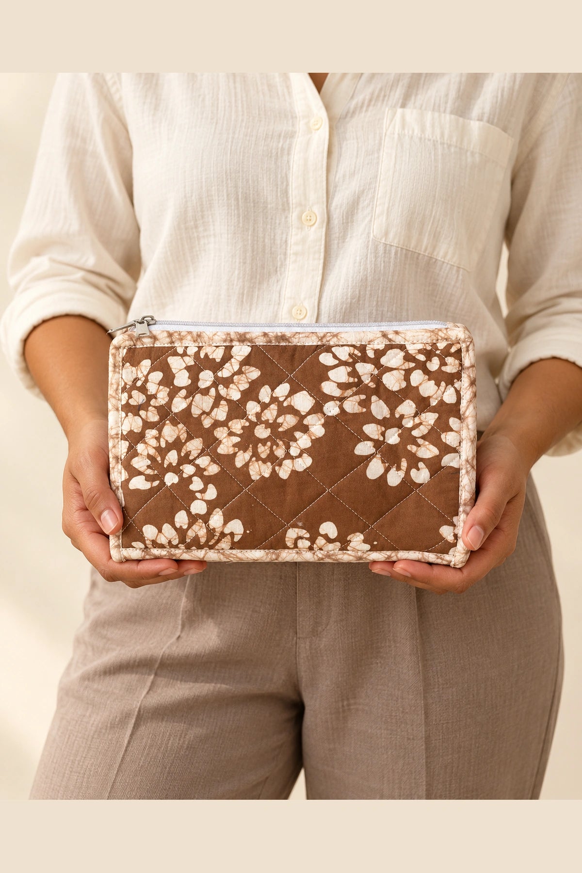 Quilted Batik Utility Pouch in Brown White Floral print – held in hand | Shades of You