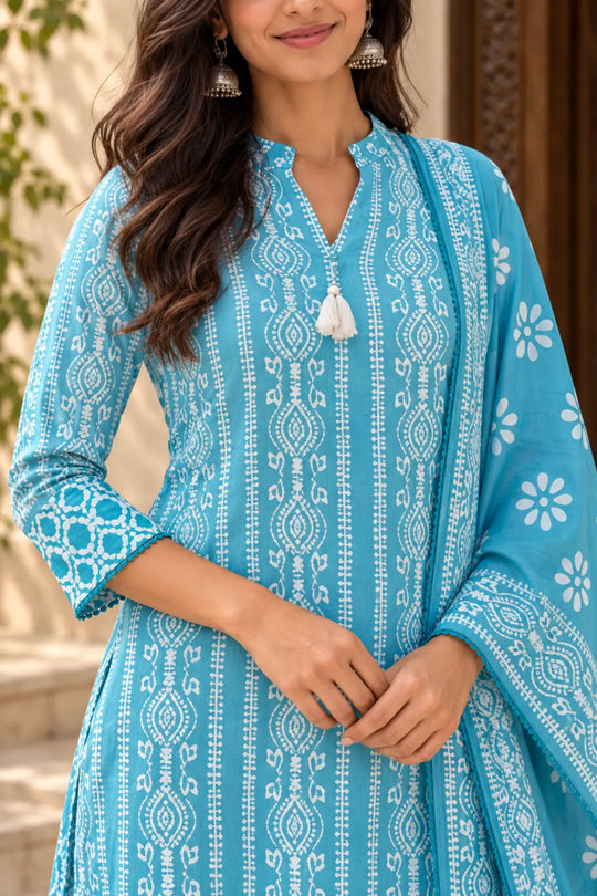 Close-up of the sky blue batik kurta's mandarin collar and tassel, detail