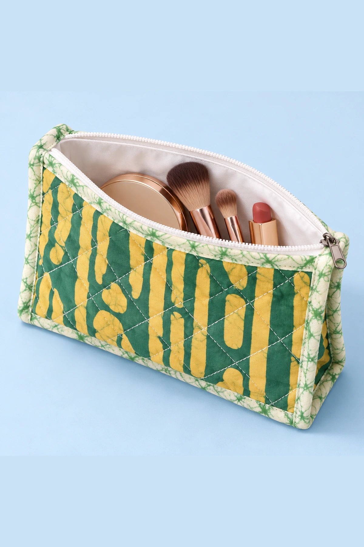 Quilted Batik Makeup Pouch in Green Mustard Stripe print – open, showing the lined interior | Shades of You