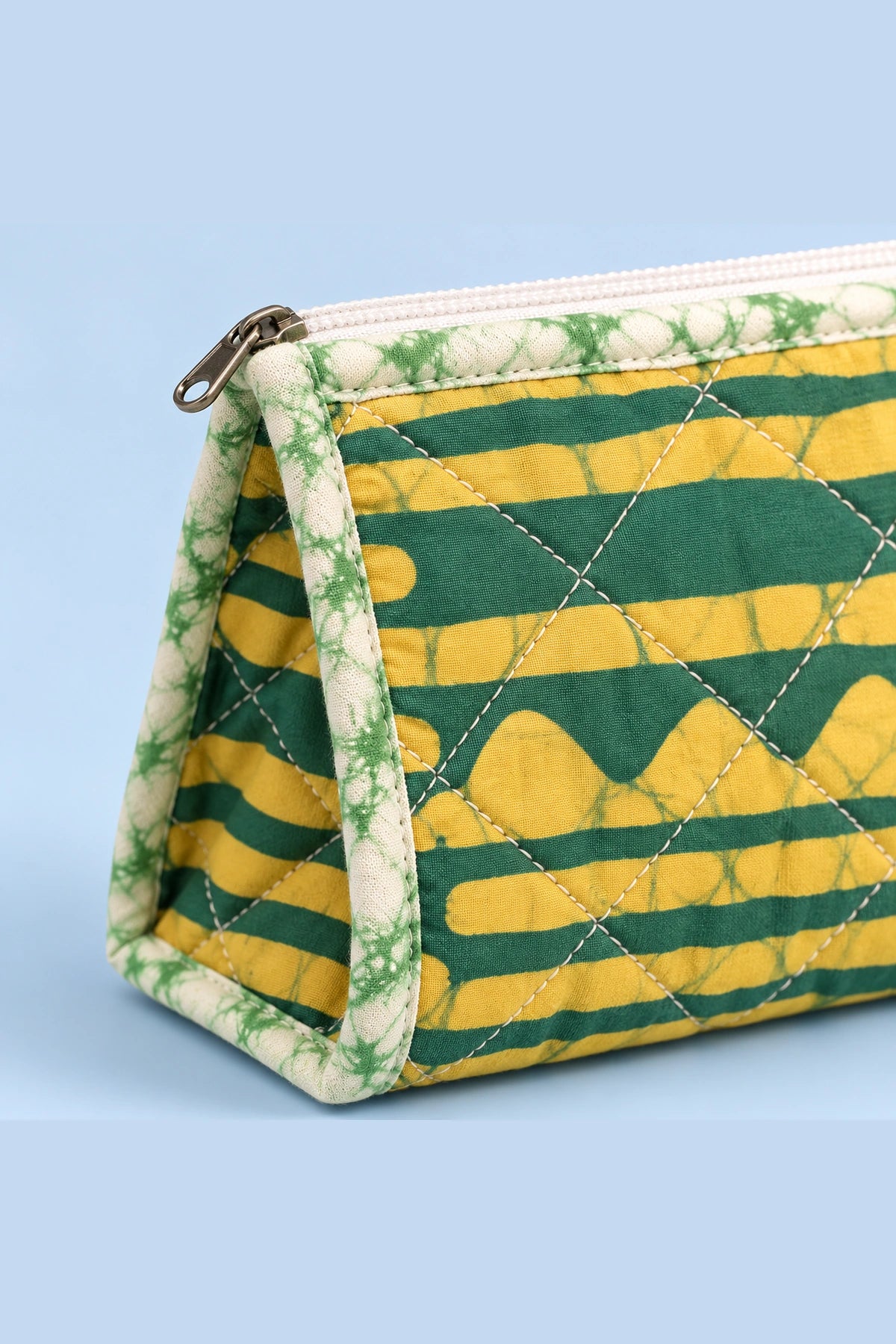 Quilted Batik Makeup Pouch in Green Mustard Stripe print – close-up of zip and quilted batik | Shades of You
