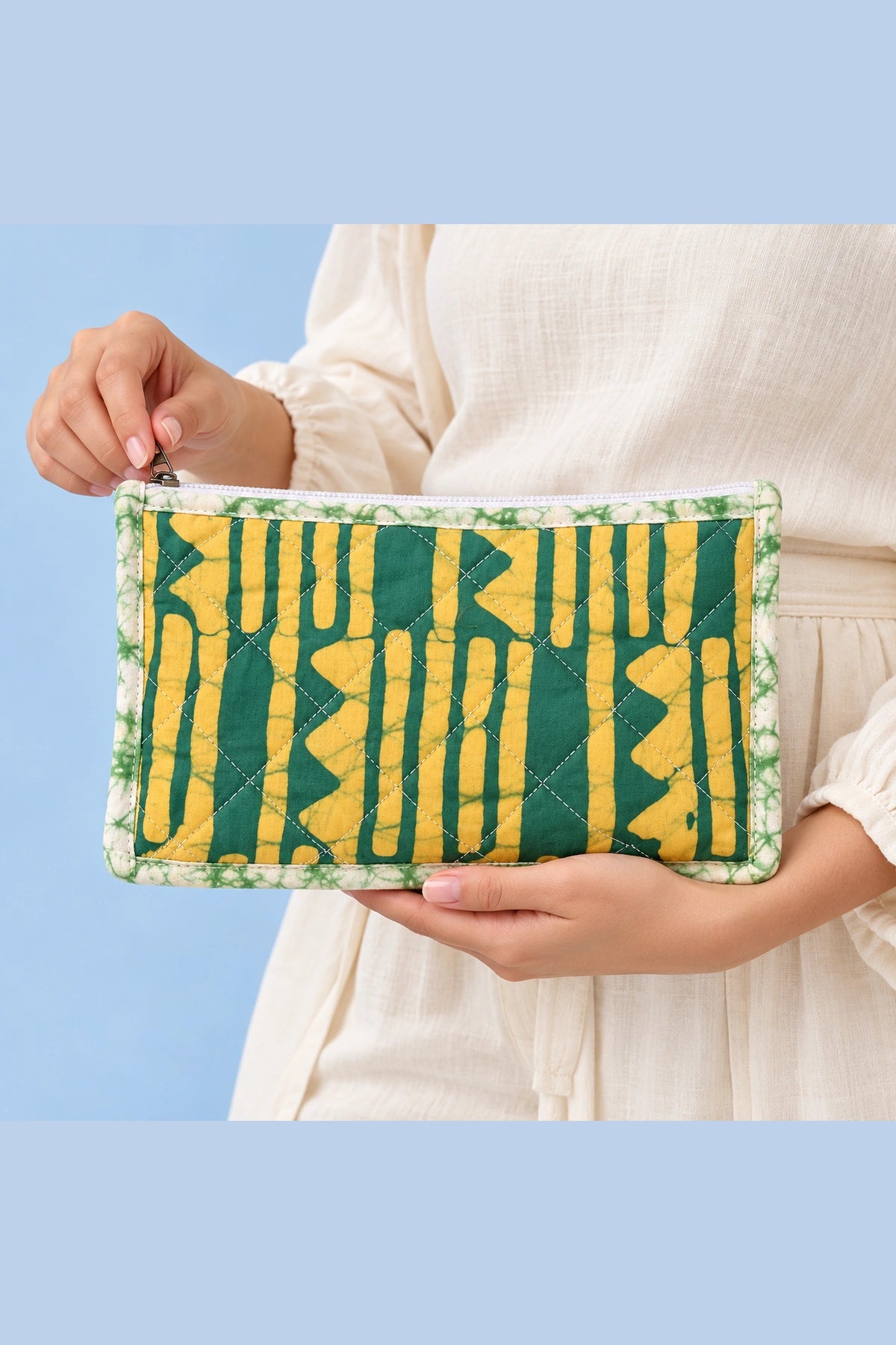 Quilted Batik Makeup Pouch in Green Mustard Stripe print – held in hand | Shades of You