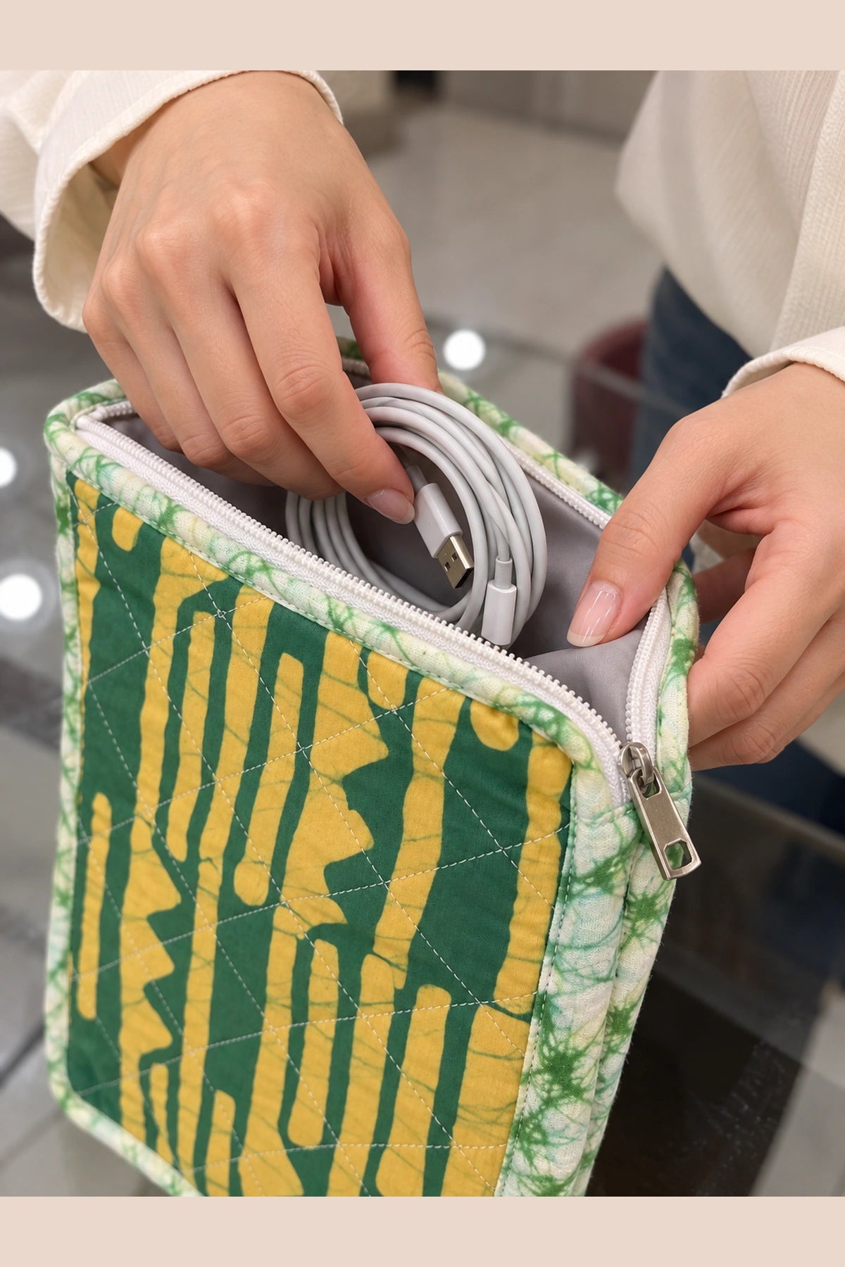 Quilted Batik Utility Pouch in Green Mustard Stripe print – held in hand | Shades of You