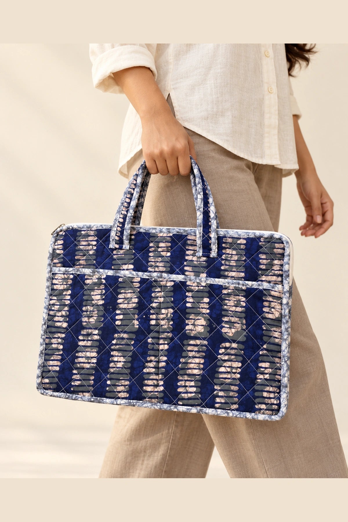 Quilted Batik Laptop Bag in Indigo Ikat Stripe print – held in hand | Shades of You