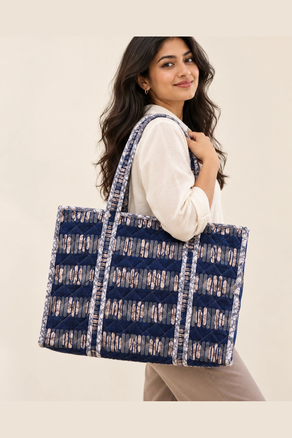Quilted Batik Tote Bag in Indigo Ikat Stripe print – held in hand | Shades of You