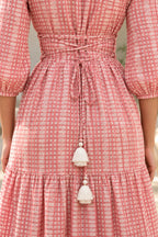 Close-up of adjustable corset back lacing with ivory tassels on Miss Rose batik dress