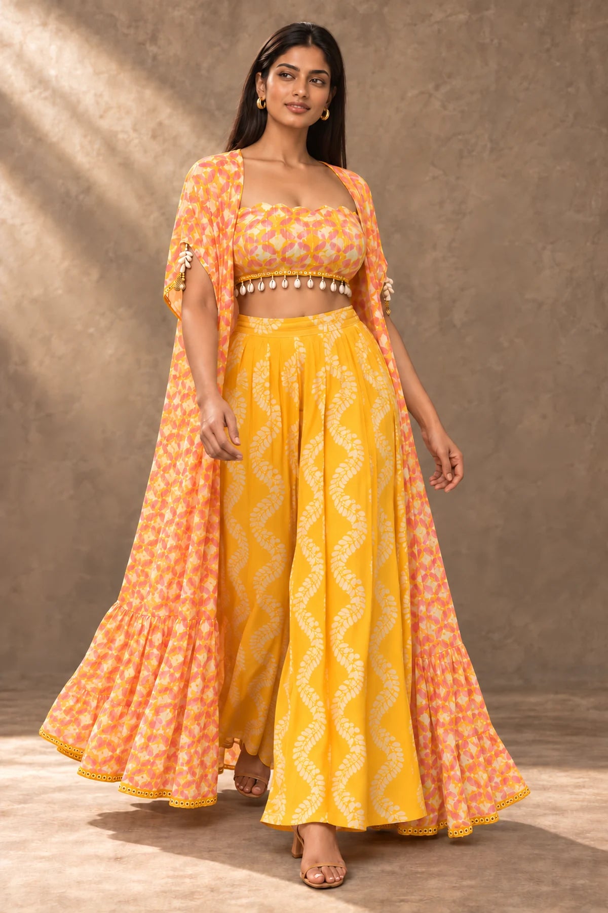 Kesar Saffron Batik Cape & Palazzo Set – front view in motion showing the cape's flare | Handcrafted batik | Shades of You