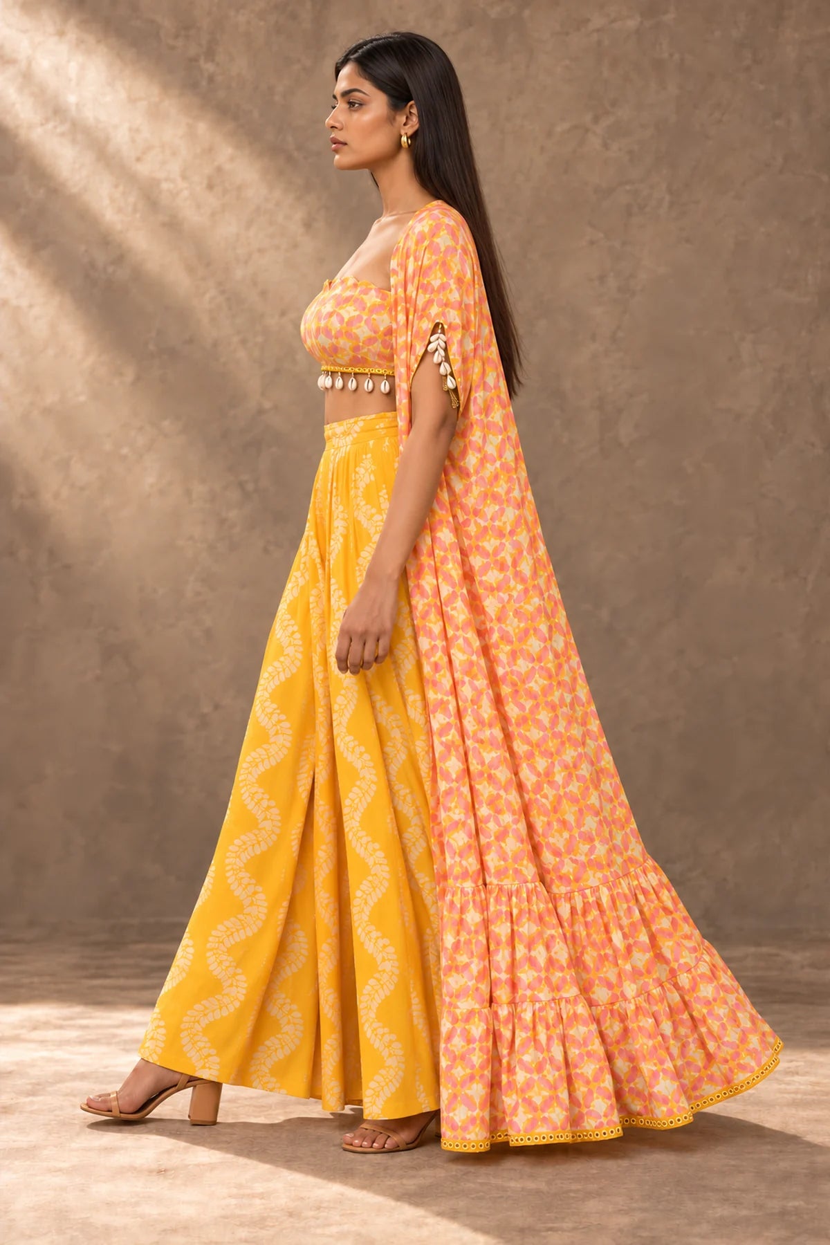 Kesar Saffron Batik Cape & Palazzo Set – side profile with cowrie shell sleeve tassel | Handcrafted batik | Shades of You