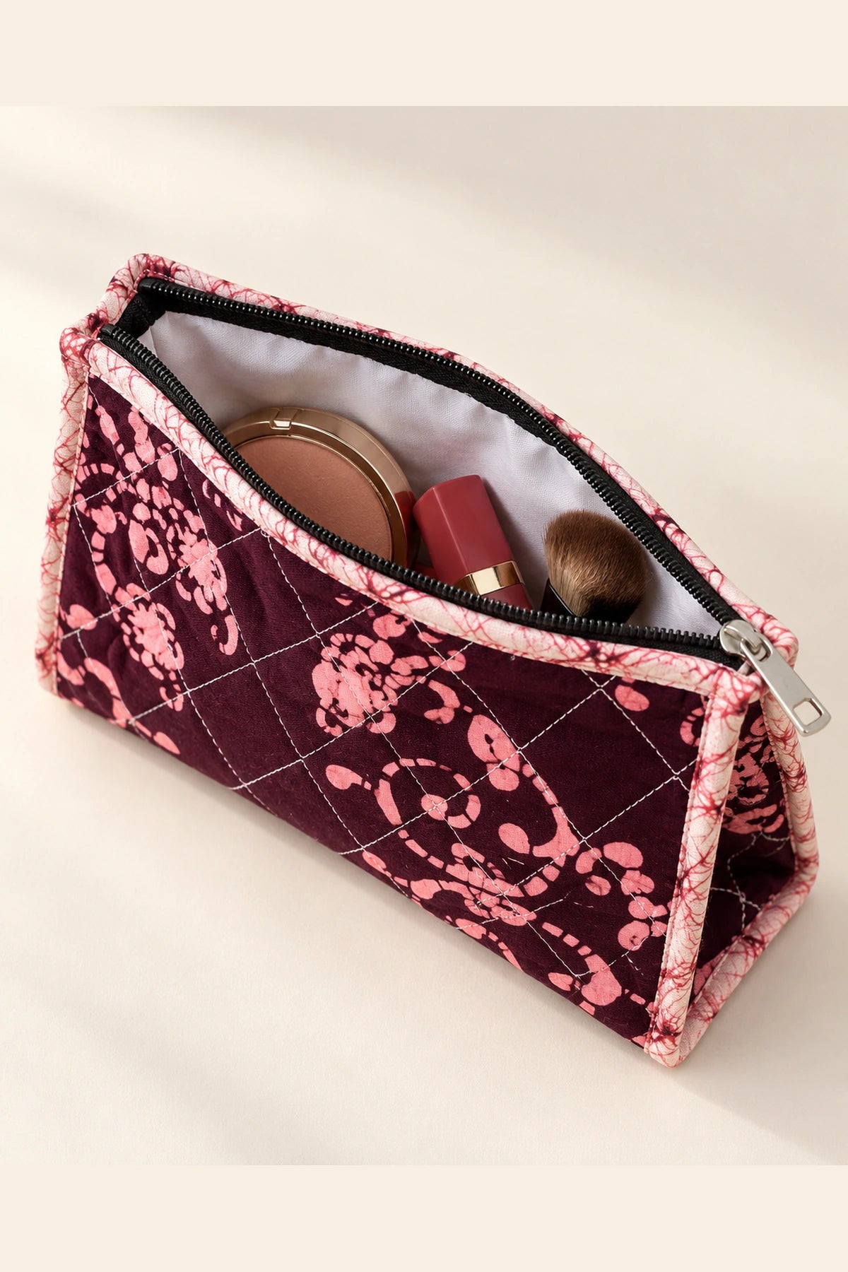 Quilted Batik Makeup Pouch in Wine Pink Floral print – open, showing the lined interior | Shades of You