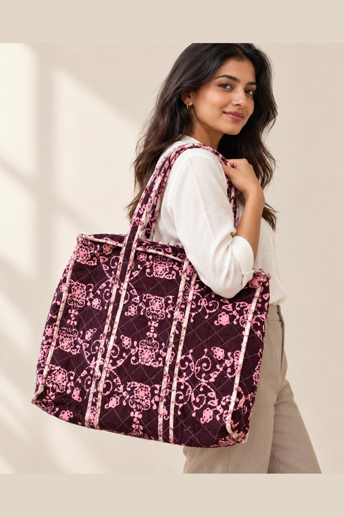 Quilted Batik Tote Bag in Wine Pink Floral print – held in hand | Shades of You